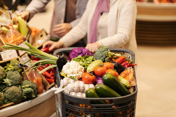 A shopping cart full of fresh healthy vegetables at the supermarket. © Dusan Petkovic