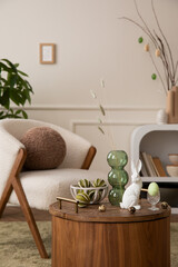 Aesthetic composition of easter living room interior with boucle armchair, round pillow, vase with...