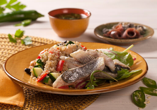Bass filet with a couscous and vegetables salad