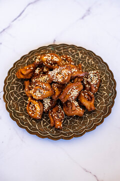 Chebakia - Moroccan pastry made of strips of dough rolled, deep-fried, coated with a honey and rosewater syrup