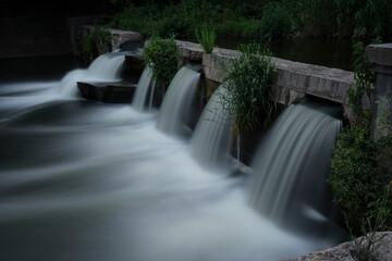 water flowing over the waterfall. long exposure - 30 seconds. Blue Water Flow. water flow surface....