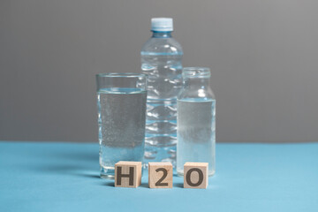 fresh pure drinking water, wooden cubes with h2o text