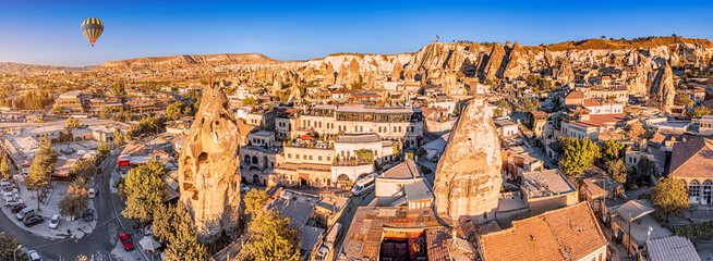 Aerial view of Air Balloon and hotels and houses of soft volcanic tuff in Cappadocia - one of the...
