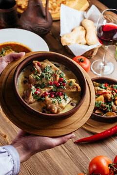 Georgian cuisine, meat and vegetables on a wooden background