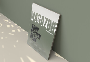 Magazine Mockup on a Clean Dry Green Wall With Leafs Shadows in the Floor