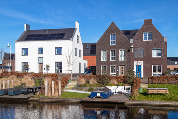 New modern residential buildings along the canal in the Vathorst district in Amersfoort.