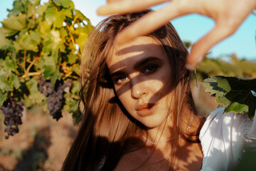 Young woman posing in the grape fields.
