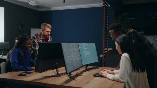 multiethnic team working in IT company, programmers and data scientists, black and caucasian workers