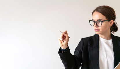 Defocused woman in glasses working with virtual screen interface infographic using digital touch pen.