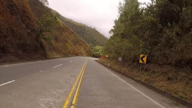 Andean highway with wide shoulders to drive comfortably on a semi-cloudy and humid day