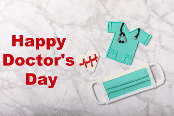 Doctor's Day greeting card with gingerbread on a marble background. Cookies for the day of the doctor in the form of medical equipment. Concept of healthcare and medicine.