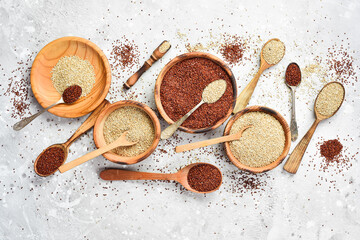 Quinoa set Red, white and brown quinoa. On a black background. Top view. Free copy space.