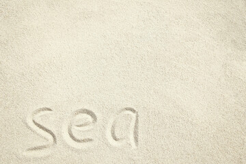 A drawing on the sand by the sea travel background