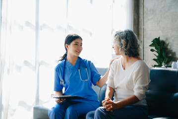 Kind nurse together with elderly woman in the hospital's or home.