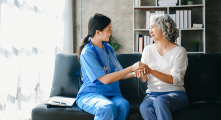 Kind nurse together with elderly woman in the hospital's or home.