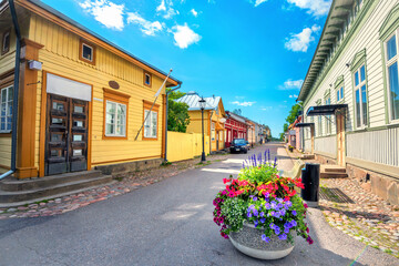 Fototapeta na wymiar View of main street with colorfl wooden houses in old finnish town Naantali. Finland