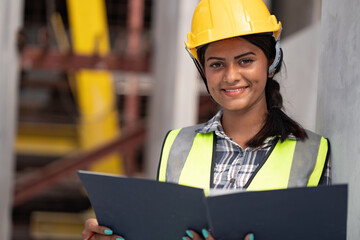 India engineer woman working with document at precast site work

