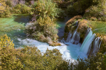 Naklejka na ściany i meble Close up of a small waterfall on the Krka river in the Krka National Park