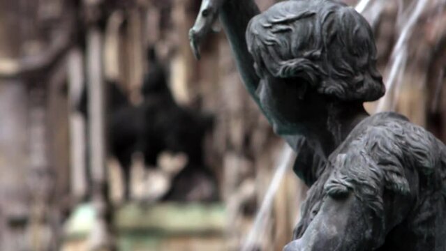 Closeup shot of fountain and a statue