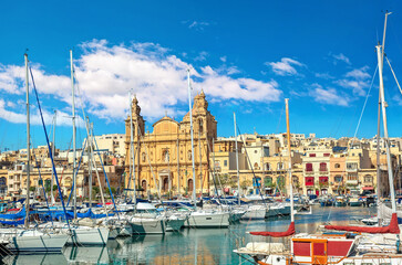 View of marina boats and catholic church in Msida. Valletta, Malta