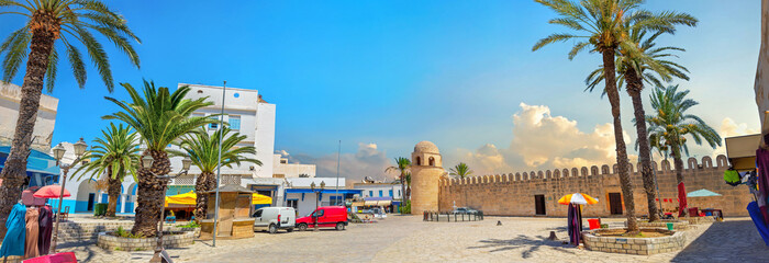 Fototapeta na wymiar Bazar square with medieval fortress wall of Ribat in Sousse. Tunisia, North Africa