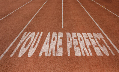 You are Perfect written on running track, New Concept on running track text in white color