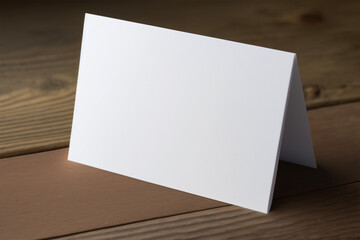 Blank white postcard standing on wooden table.Copy space.Text space.isolated background.Created with generative ai