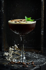 Summer cocktail and bar concept. Fresh alcoholic cocktail with coffee liqueur and coffee beans and ice. Bar menu.