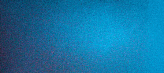 Turquoise panoramic wall texture. Surface with magenta light reflected on a blue wall.