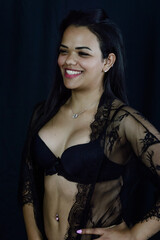 Portrait of a beautiful young Brazilian woman in underwear smiling