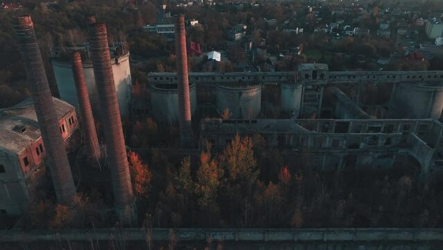 Abandoned old production plant, cement plant in Bedzin, Grodzisk, Poland. Concept of abandoned places, industrial ruins, urbex. View from the drone, air.