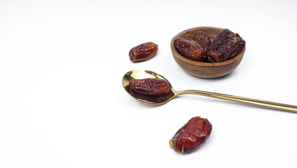 delicious dried dates (Kurma) isolated on white background - selective focus