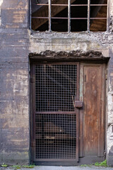 Fototapeta na wymiar old rusty door in abandoned building