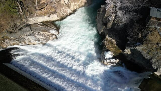 the lech fall near f&uuml;ssen in bavaria in the alps where a lot of water flows into the valley and the water flows back and forth between the rock walls recorded with a drone