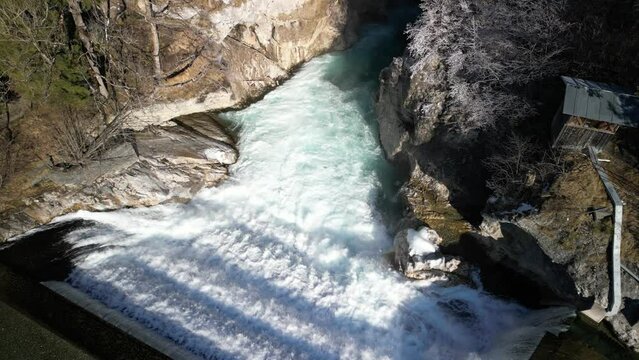 the lech fall near f&uuml;ssen in bavaria in the alps where a lot of water flows into the valley and the water flows back and forth between the rock walls recorded with a drone