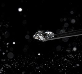 Excellent cut diamonds held by tweezers on white shining bokeh background. concept for choosing...