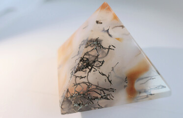 Dendrite mineral growing in carnelian crystal pyramid looking like plant fossils