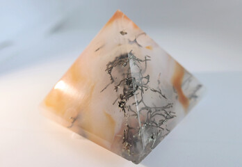 Dendrite mineral growing in carnelian crystal pyramid looking like plant fossils