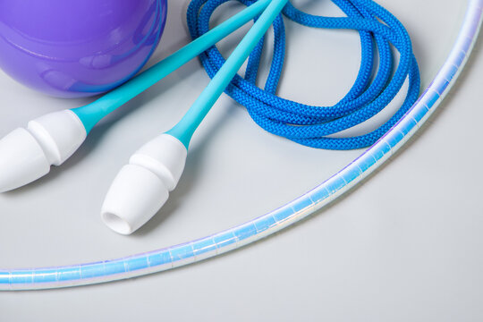 Subjects for practicing rhythmic gymnastics. Hoop, ball, clubs, rope. Selective focus.