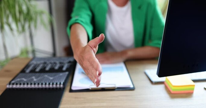 Professional business woman recruitment consultant extending hand for handshake