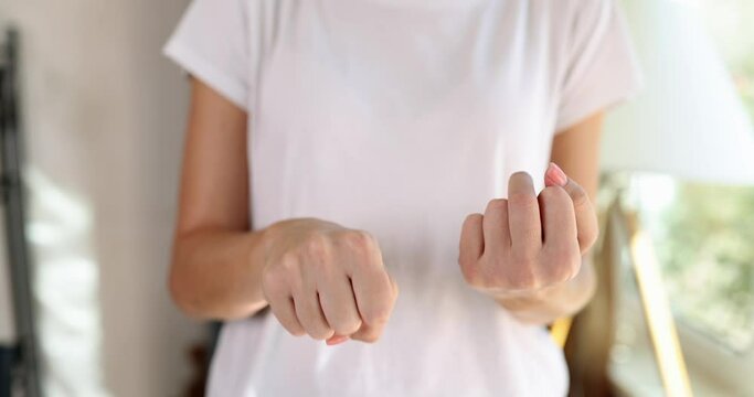 Woman showing fist and middle finger fucking gesture