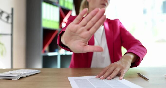 Business woman rejects document for signing in office
