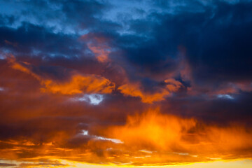 Naklejka na ściany i meble Clouds in the sky at sunset. fantastic sky.