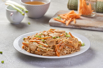 Chicken chow popular oriental dish with noodles and vegetables