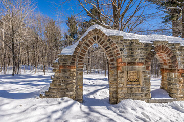 Ruins in a winter wonder land not far away from Ottawa, Ontario in Canada at a cold but sunny day in winter.