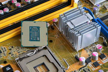 CPU socket and processor on the motherboard. Before installation processor. Motherboard digital chip. Technology background