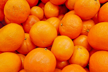 Stack of tangerines on a market stall