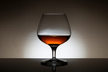Backlit glass of cognac