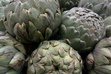 Fototapeta premium Stack of artichokes on a market stall