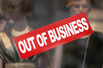 Out of business banner in a window shop